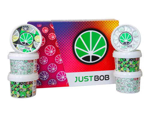 JustBob CBD Gras Kit Back2Work - Farbiger Hintergrund mit Dosen