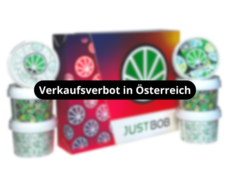 JustBob-CBD-Kit-fruit-Farbiger-Hintergrund-mit-Dosen-blueten-verkaufsverbot-in-osterreich